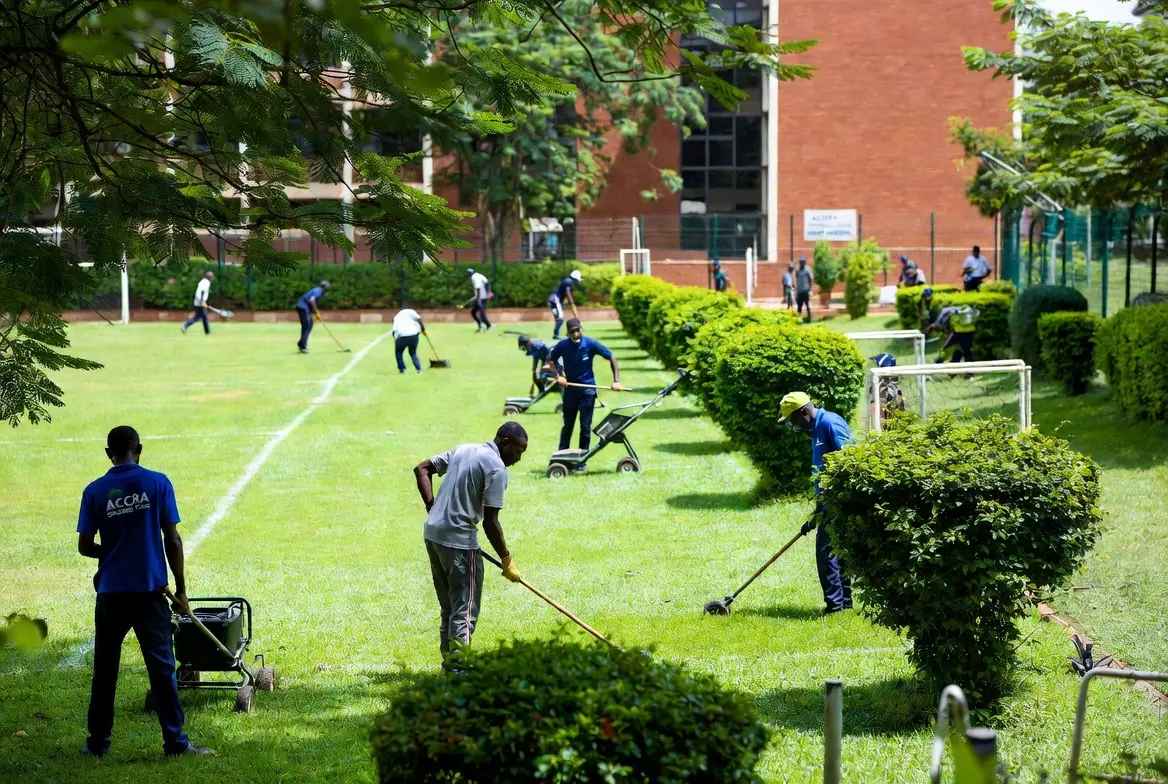 Carpet-grass field and campus lawn kept safe and tidy at a school in Accra